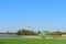 04/11/2020, in Germany, Bavaria, Swabia, excavators stand on a lake against a blue sky and is ready to dig gravel