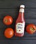 04 February 2017 Ukraine Kiev Heinz, sauce Ketchup Bottles on a black wooden tomatoes