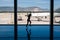 05/26/2019. Bodrum Airport / Milas Mugla Airport. Turkey. Small girl doing cartwheels exercise out of boredom while awaiting for h