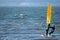 06/09/2019 Gosport, Hampshire, UK A lone windsurfer riding his board over waves