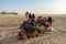 06.11.23 Sahara, Tunisia: Group of tourist ride on camels at sunset in Sahara Desert Tunisia.
