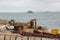 07-07-2021 Portsmouth, Hampshire, UK An excavator and a dumper working on coastal defences at Southsea in Portsmouth with the sea