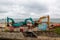 07-07-2021 Portsmouth, Hampshire, UK An excavator and a dumper working on coastal defences at Southsea with the sea in the