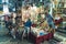 07.13.2022 Thessaloniki, Greece. Interaction between Greek male seller and customers at famous Kapani Market. People