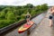 08-08-2020, Pontcysyllte Aqueduct, Wales, UK. Woman on paddling board crossing River Dee