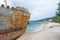 08-15-2015, Trogir, Croatia. Abandoned shipwreck washed ashore spoiling Adriatic Sea coastline.