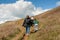 08-29-2020 West Bay, UK. Family enjoying walking on top of Jurassic Cliffs. towering cliffs on sunny summer day.