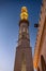 09/11/2018 Hurghada, Egypt, Minaret of the new snow-white mosque Al Mina on the Red Sea coast at dusk and illuminated