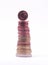 1 cent coin standing on top of stack of euro coins.