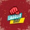 1 may Happy labour day vector label with strong protest fist in the air on vintage red background. vector happy labor