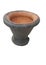 1 piece of terracotta mortar, brick red, black, straight up to see the front and the top, circular, and the edges are about 1 inch