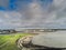 10/04/2019 Galway city, Ireland.Aerial view, Port and South park, low tide, Cloudy sky