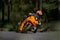 10-05-2021 Lithuania, Kaunas MotoGP rider, Motorcyclist ride in corner. Road in forest