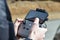 10 April 2022 - Krakow, Poland: Pilot holds the DJI remote controller in hands and remotely controls the Drone DJI Mavic Mini 2