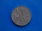 10 liras coin, Italy over blue