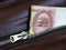 10 Rubles Russian banknote and retro leather bag