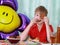 A 10-year-old boy eating a sweet berry pie.On a blue - blue background, close-up. Boy, young, child, desserts, candy, cookies, hap