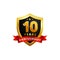 10 years anniversary golden shield badge logo with ribbon