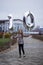 10 years birthday. the girl is holding large silver numbers one and zero. Cute joyful birthday girl with balloons