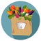100 percent natural, organic on a paper bag full of fresh vegetables. Concept of diet, vegetarian, vegan. Grocery delivery