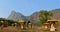 1000 Buddhas garden at sunset in Hpa-An, Myanmar. Mount Zwegabbin on the background. Panoramic view.