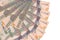 1000 Guyanese dollars bills lies isolated on white background with copy space stacked in fan shape close up