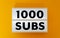 1000 subs on yellow background