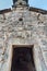 1000 year old doorway of the church of St John,looking up to the bell tower, Kotor,Montenegro
