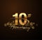 10th golden anniversary logo with swoosh and sparkle golden colored isolated on elegant background, vector design for greeting