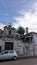 11.04.2023 An old abandoned church in Lisbon against the backdrop of a palm tree and the sky