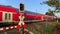 11/14/2020 hude germany: a regional train of the deutsche bahn drives past a level crossing