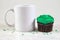 11 ounce Coffee Cup Mock Up with Green Frosted Cupcake