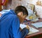 11 year old boy teenager doing school homework