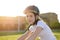 11 year old girl in a helmet rides a bicycle. Girl with a bike in the park. Portrait of a child in a bicycle helmet