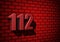 112 emergency number on dark wall