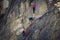 12.06.2020 - Austria. Closeup of three climbers during their final ferrata ascent next to Stausee Mooserboden in the Kaprun region