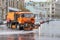 12-10-2019, Moscow, Russia. Big orange Kamaz watering Tverskaya street. City special transport washes the road in the city center