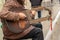 12-10-2019, Moscow, Russia. Unusual musical instrument in the hands of a street musician. A guitar with two necks sounds like a