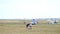 12 August 2016, Kazan, Russia - Kurkachi air show: two smart boys use model aircraft on the airfield, wide angle