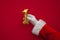 12 days of christmas. Santa hands holding 1st day balloon on red background