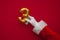 12 days of christmas. Santa hands holding 3rd day balloon on red background