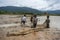 12,Dec,2016 -the kid catching a fish , Some kids of Churu people drafting the fish near by Dalat- Lam Dong- Vietnam