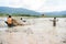 12,Dec,2016 -Some kids of Churu people drafting the fish near by Dalat- Lam Dong- Vietnam