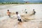 12,Dec,2016 -Some kids of Churu people drafting the fish near by Dalat- Lam Dong- Vietnam