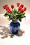 12 long stem red roses in vase
