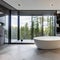 12 A modern, luxurious bathroom with a mix of marble and glass finishes, a large, freestanding bathtub, and a mix of open and cl