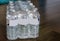 12 pack of mineral water bottles, packaged in plastic, plastic waste and environment, popular products