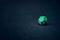 12 sided green die for a game on a background
