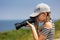 12 year old girl taking pictures in a beautiful scenic of Irish cliffs