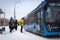 13.02.2021, Russia, Moscow. Passengers of urban land transport get on the bus at the bus stop. Winter, snowfall